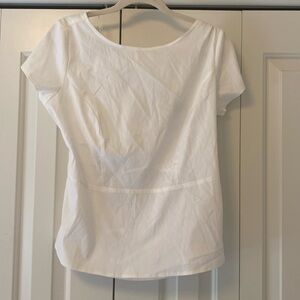And Taylor size 6 white peplum blouse open back